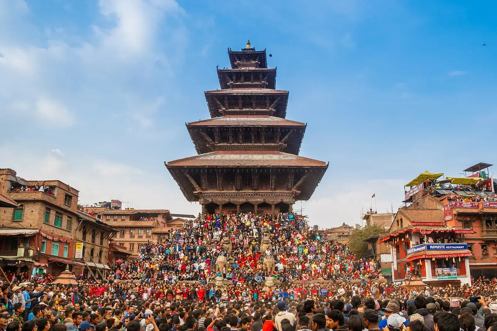 Five-storey Nyatapola temple above crowds in Taumadhi Square, Bhaktapur, during Bisket Jatra