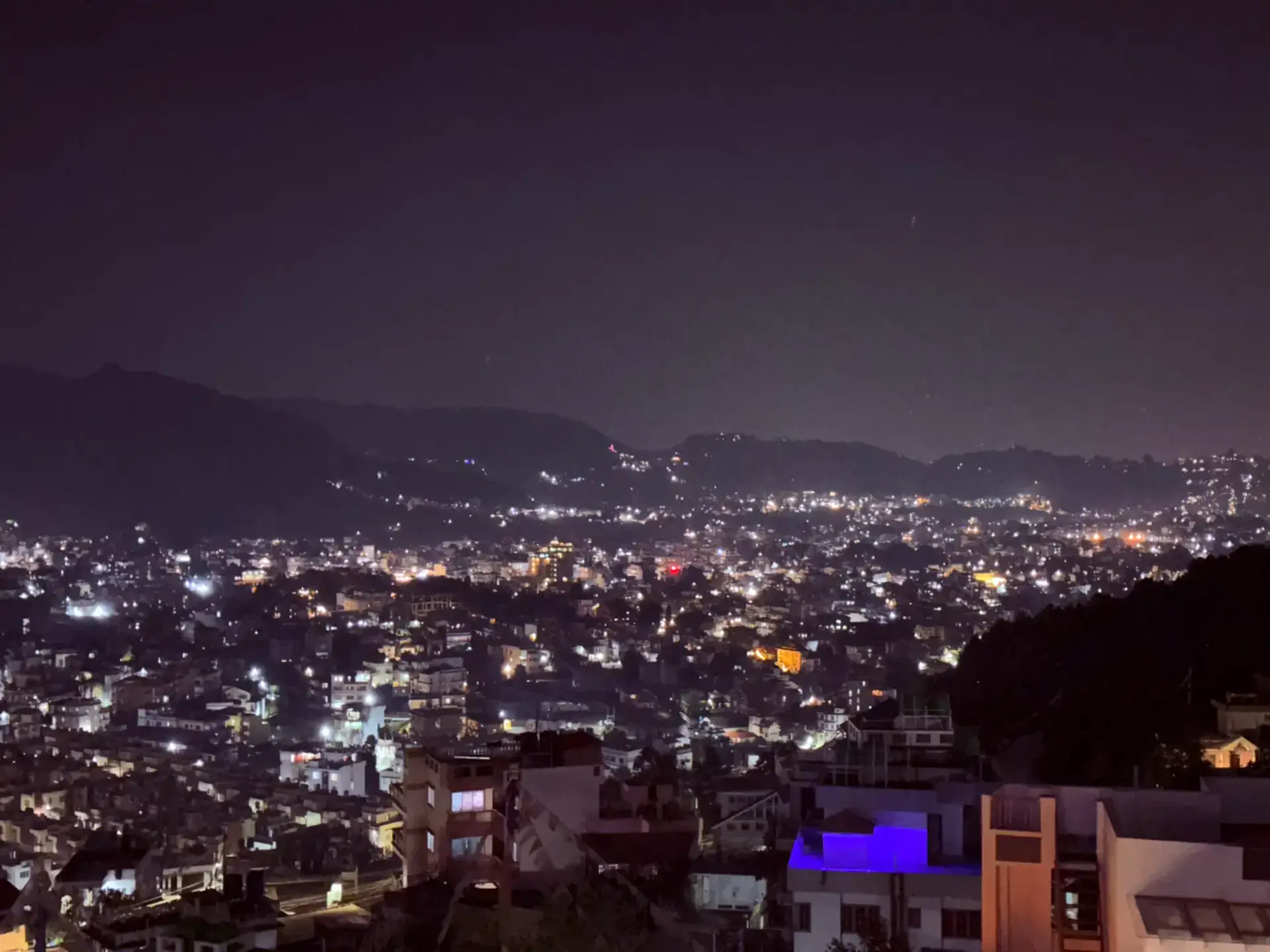 Kathmandu city lights at night from the Sacred Trails rooftop