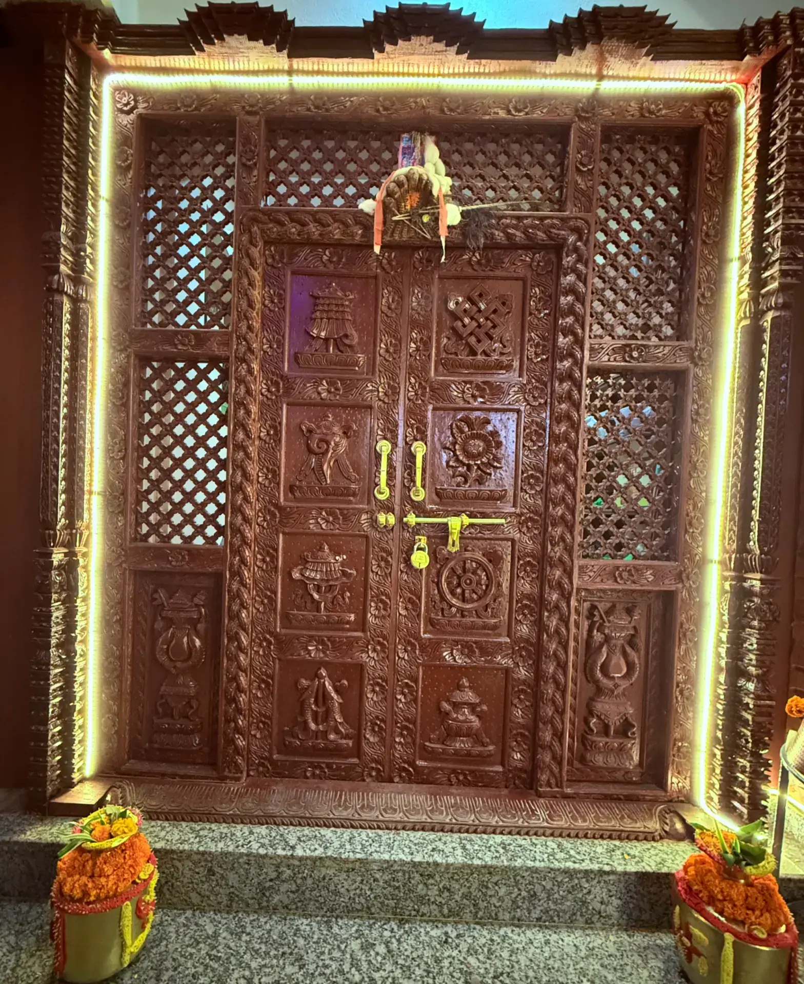 Hand-carved Newari wooden entrance door framed with lights