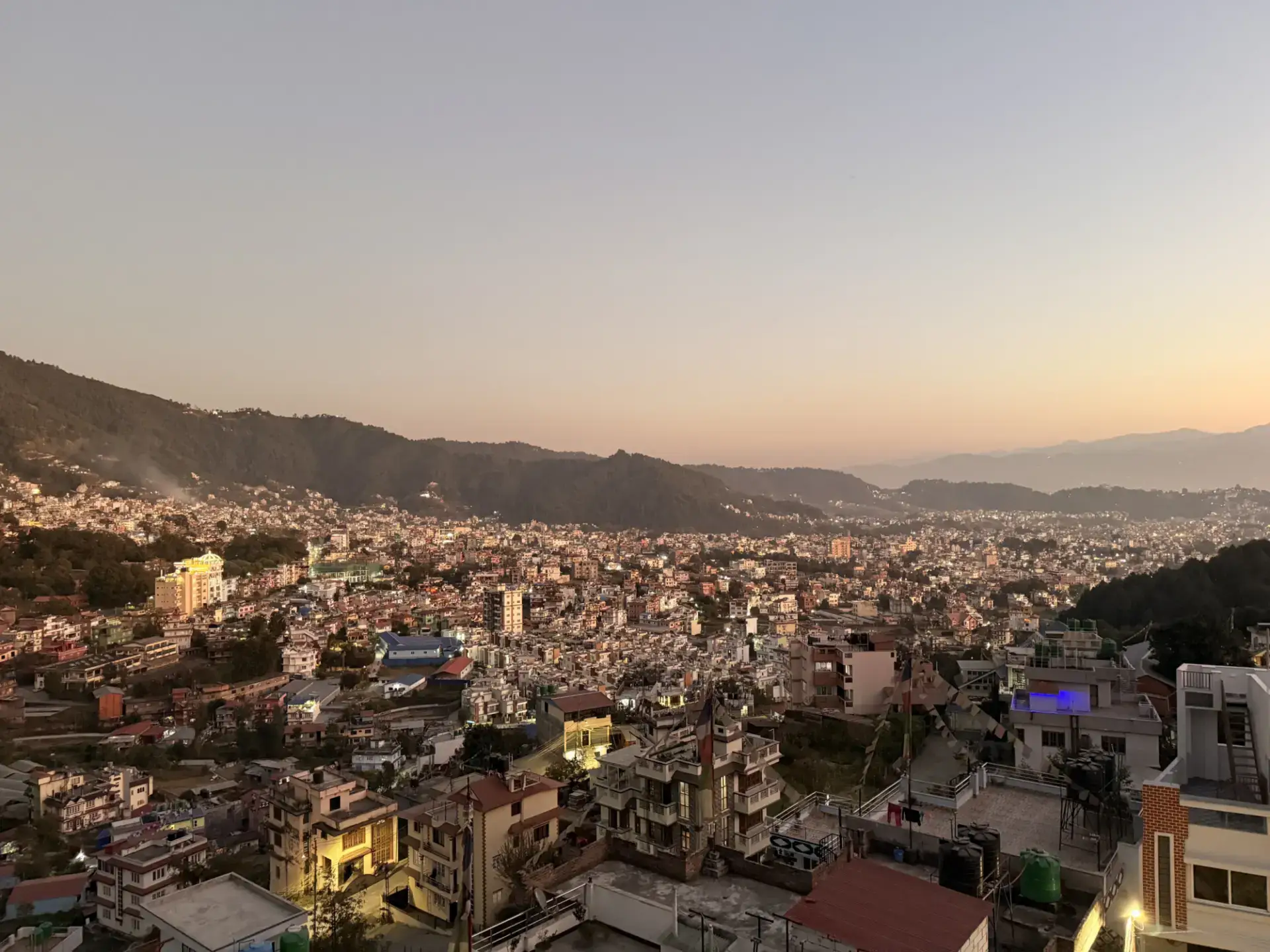 Sunset over the Kathmandu Valley seen from the Sacred Trails rooftop in Budhanilkantha