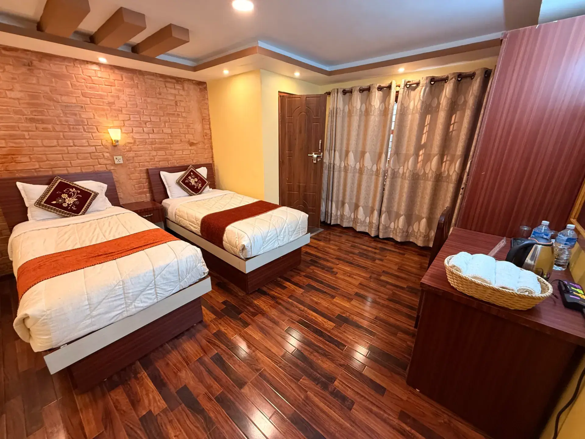 Deluxe Twin Room with two single beds and curtained windows