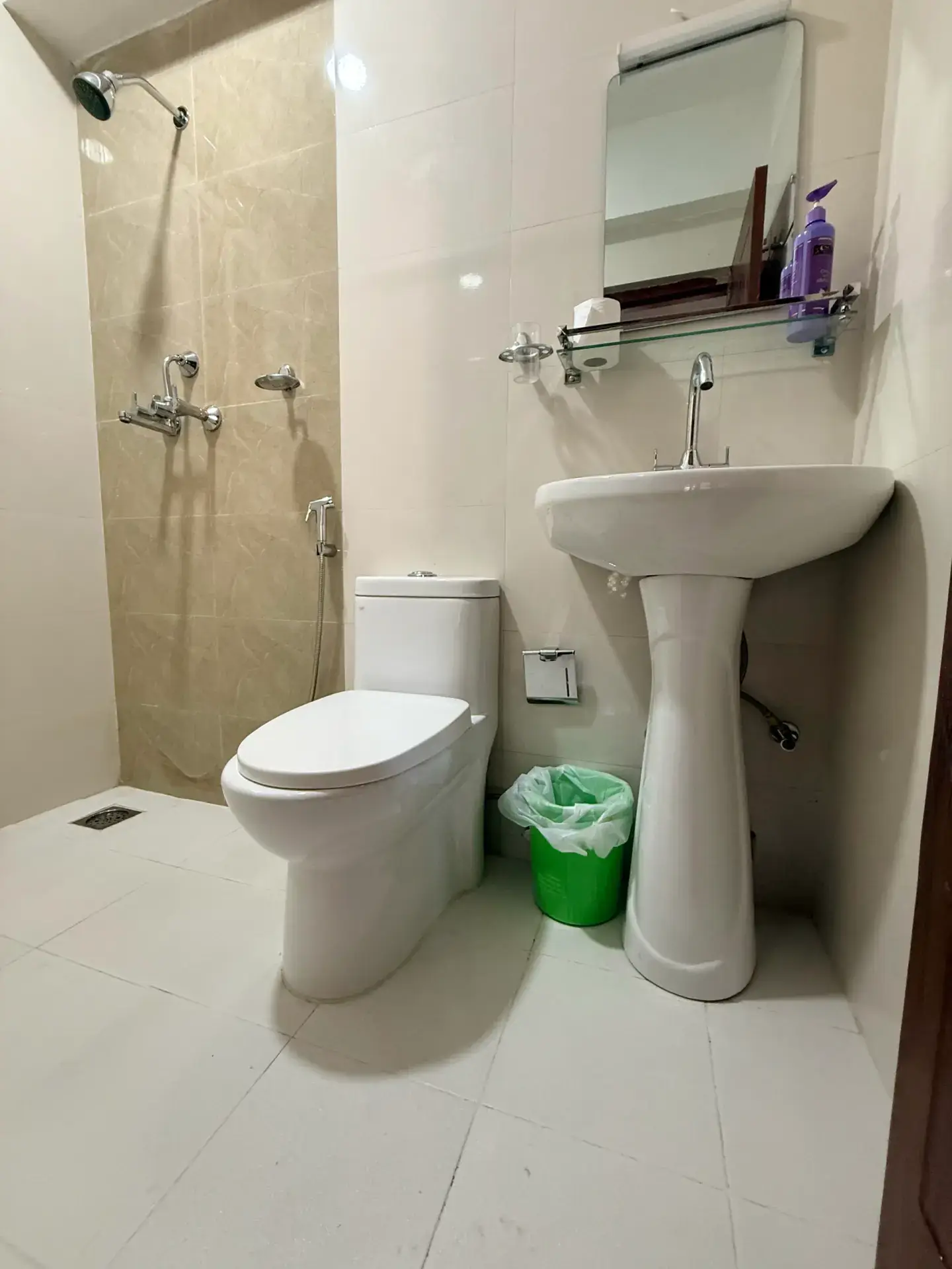 Clean private en-suite bathroom with hot-water shower