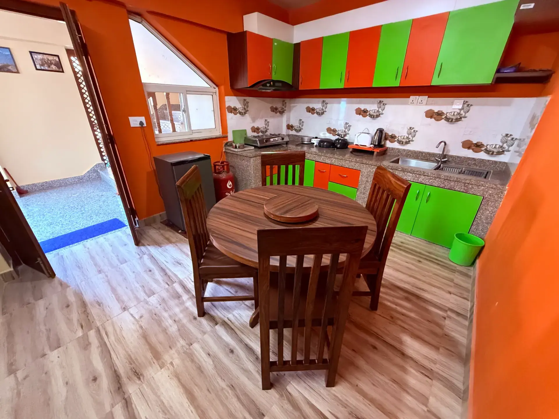 Fully equipped apartment kitchen with dining table for four