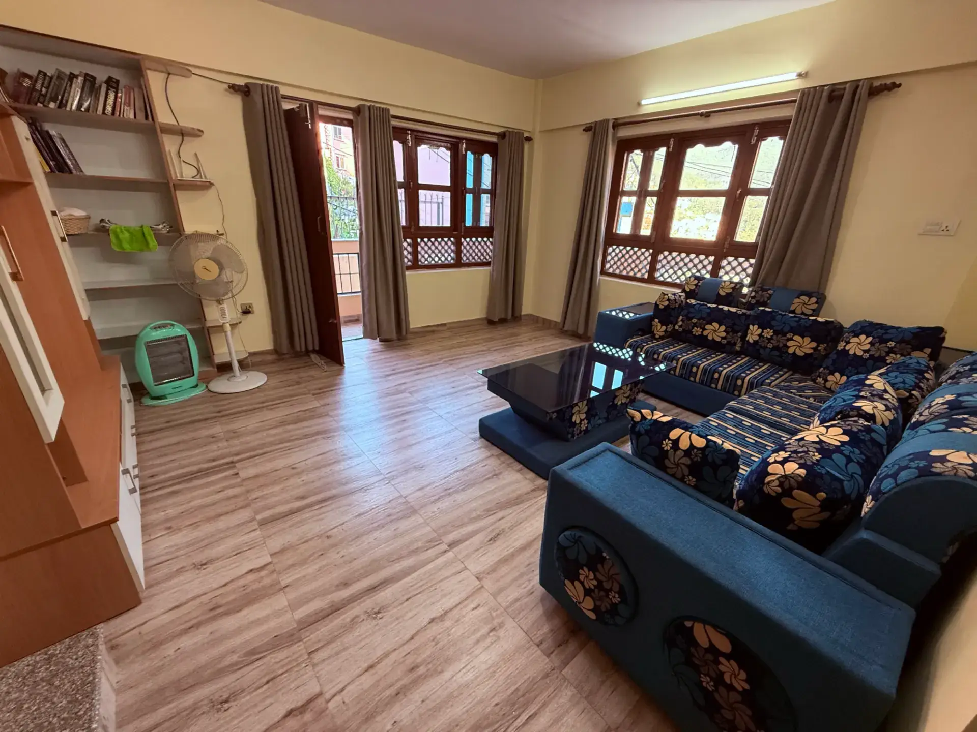 Family apartment living room with large sofa set and wooden floor