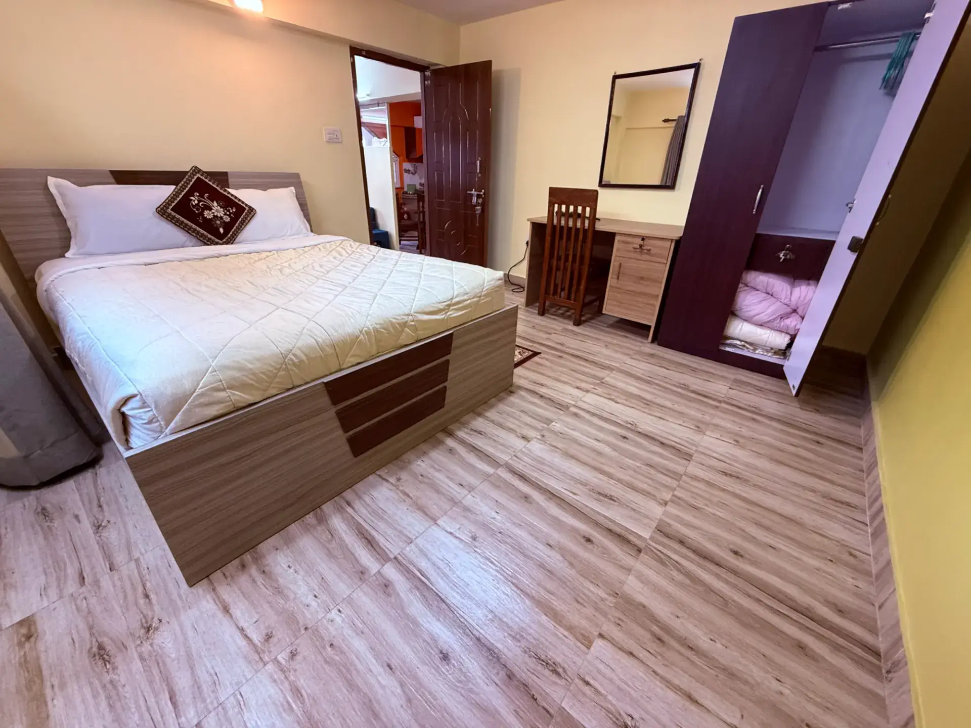 Second apartment bedroom with double bed and dressing table