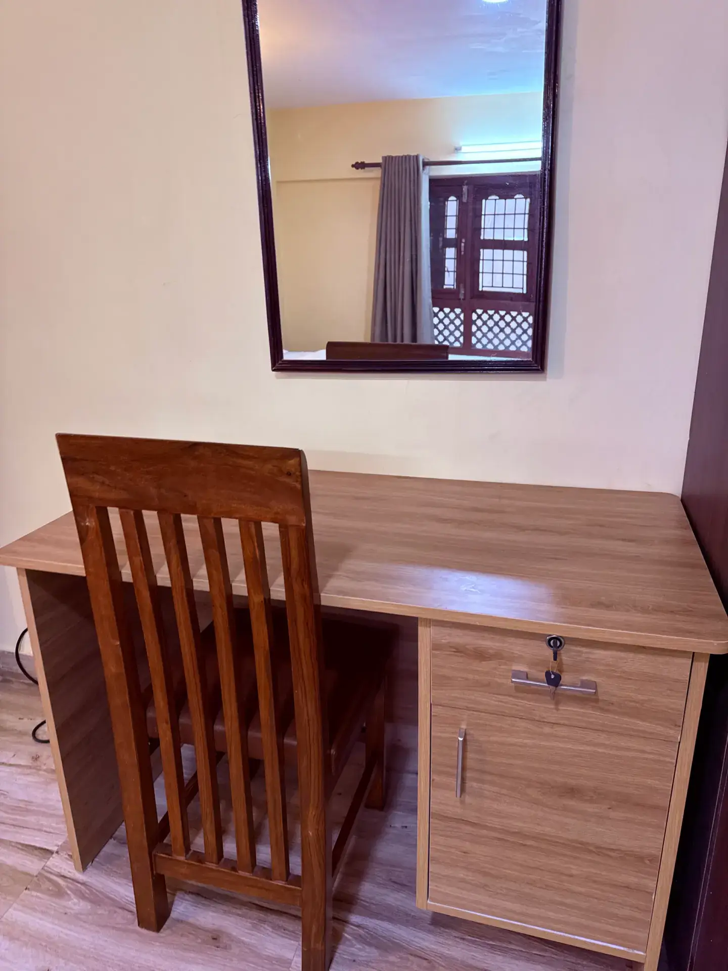 Wooden study desk and mirror for remote work or trip planning