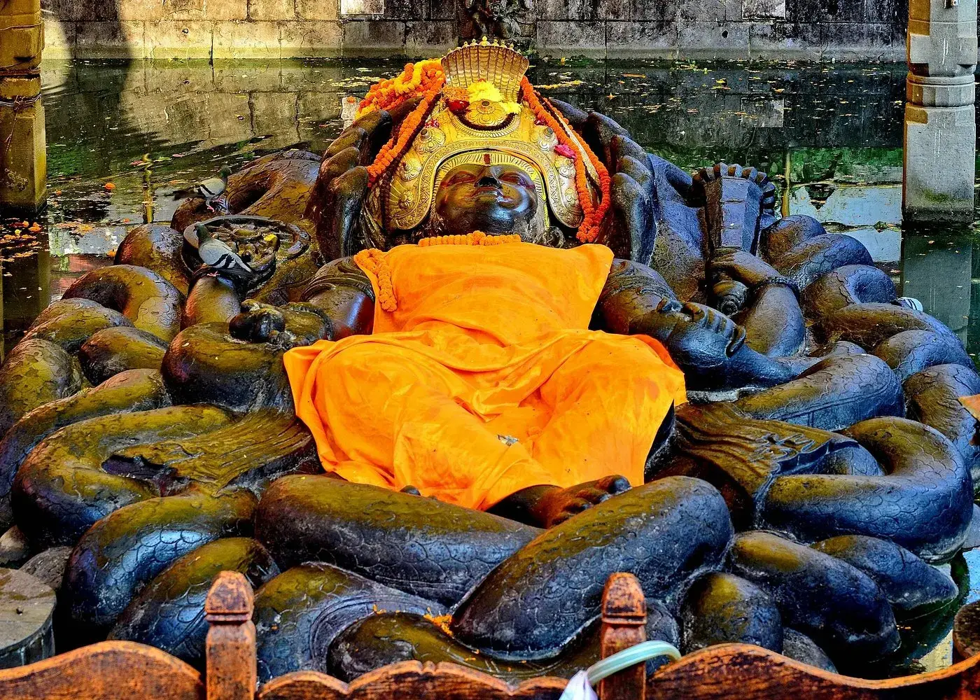 Reclining Vishnu statue on coiled serpents at Budhanilkantha Temple